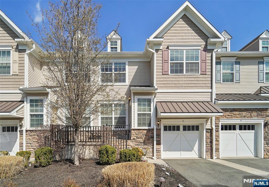 6 Masterson Ct, Waldwick, NJ 07463 - multi unit property with a standing seam roof, metal roof, stone siding, driveway, and a garage