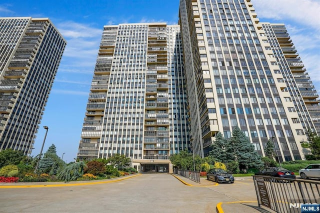 view of property featuring uncovered parking
