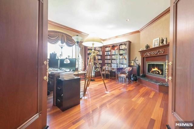 16 Shinnecock Trl, Franklin Lakes, NJ 07417 - home office with crown molding, a lit fireplace, and wood finished floors