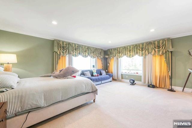 16 Shinnecock Trl, Franklin Lakes, NJ 07417 - carpeted bedroom featuring baseboards, recessed lighting, and crown molding