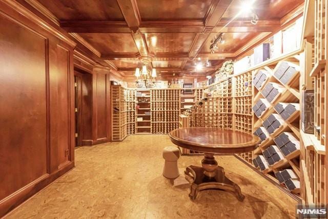 16 Shinnecock Trl, Franklin Lakes, NJ 07417 - wine area featuring coffered ceiling, ornamental molding, wooden ceiling, beamed ceiling, and wooden walls