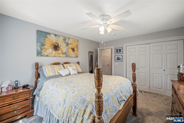 bedroom with a closet, a ceiling fan, and light colored carpet