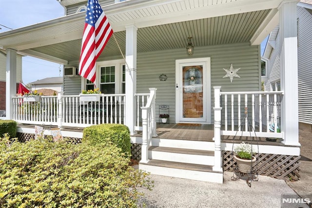 doorway to property with covered porch