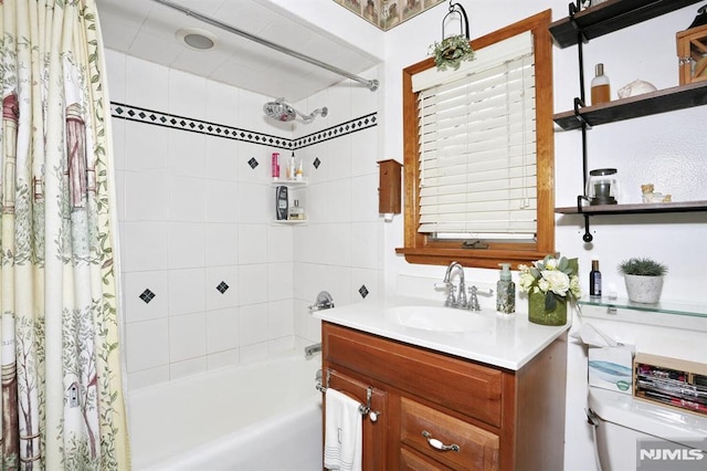 full bath featuring toilet, vanity, and shower / tub combo with curtain