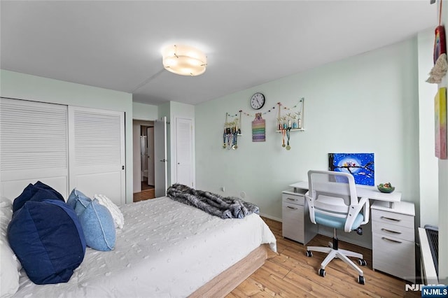 bedroom featuring light wood finished floors