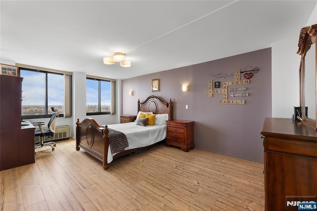 bedroom with light wood-style flooring