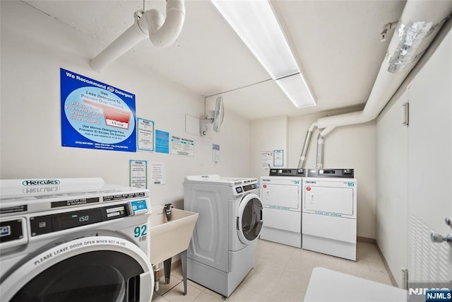 common laundry area with separate washer and dryer