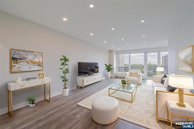 2077 Center Ave Unit 11C, Fort Lee, NJ 07024 - living room with wood finished floors, recessed lighting, and baseboards