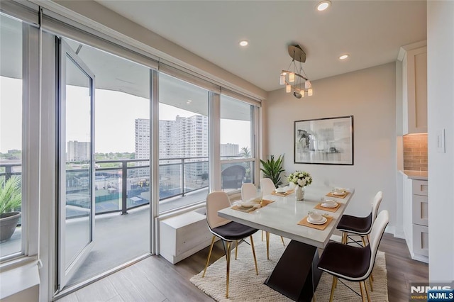 2077 Center Ave Unit 11C, Fort Lee, NJ 07024 - dining space with plenty of natural light, wood finished floors, recessed lighting, and a view of city