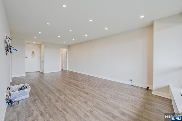 2077 Center Ave Unit 11C, Fort Lee, NJ 07024 - unfurnished living room with recessed lighting, wood finished floors, and baseboards