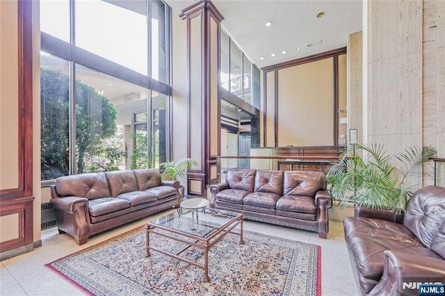 2077 Center Ave Unit 11C, Fort Lee, NJ 07024 - living area featuring a high ceiling and floor to ceiling windows