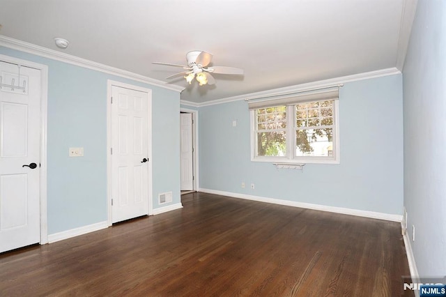 unfurnished bedroom with baseboards, dark wood-style floors, ornamental molding, and a ceiling fan