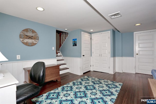 office featuring a wainscoted wall, wood finished floors, and recessed lighting