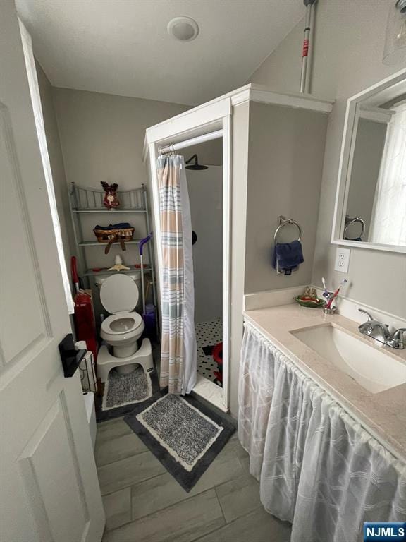bathroom with tile patterned floors, vanity, and a shower with shower curtain