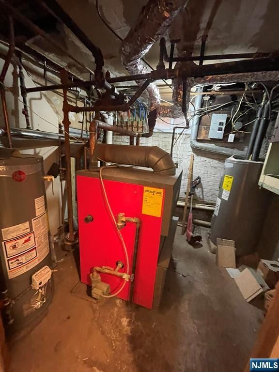 utility room featuring electric water heater and gas water heater