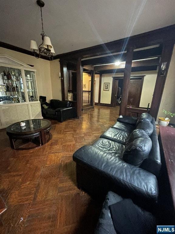 living area featuring an inviting chandelier