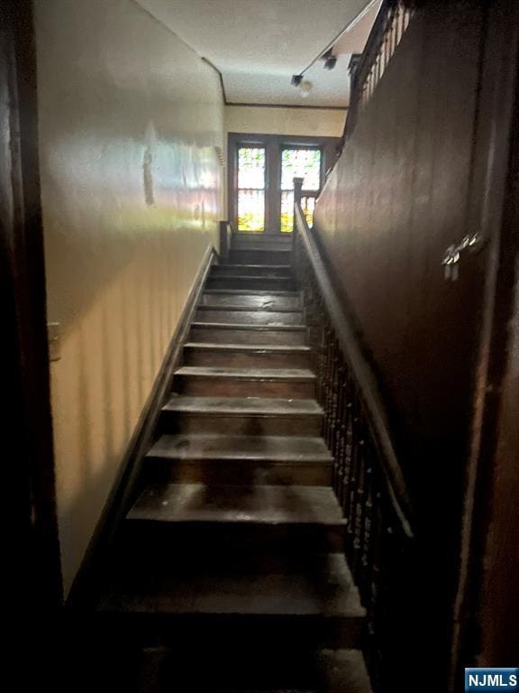 stairs with wood finished floors
