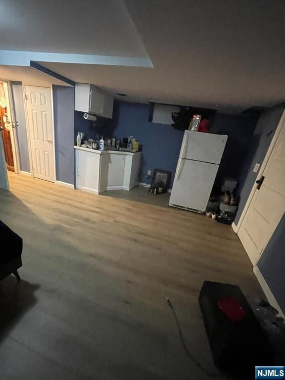 kitchen featuring freestanding refrigerator