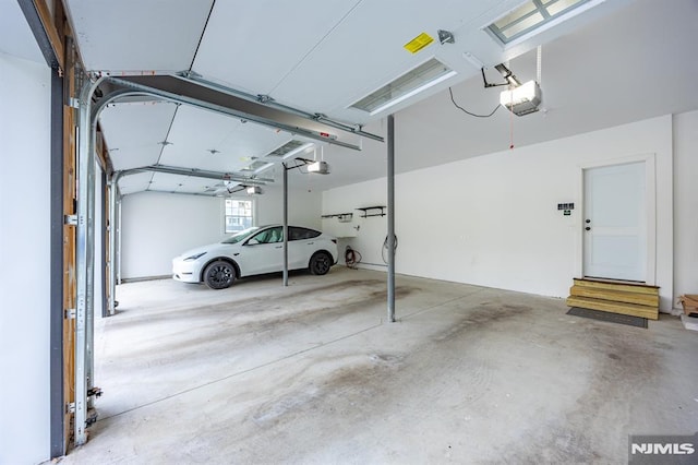 garage featuring a garage door opener