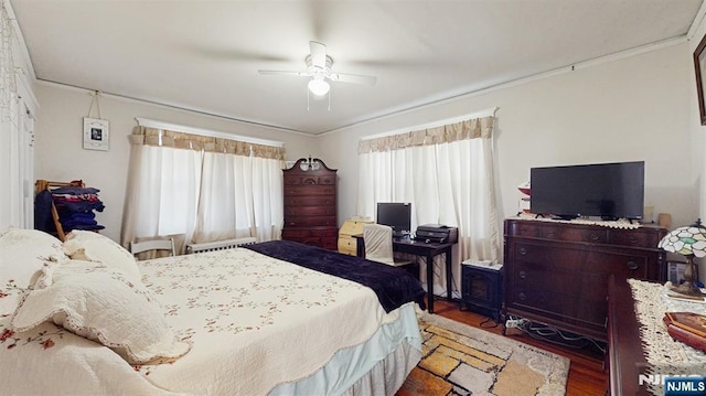 bedroom with ceiling fan and wood finished floors