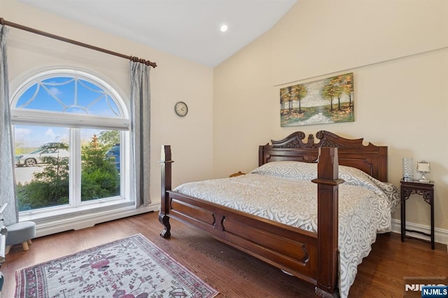 bedroom with recessed lighting, dark wood finished floors, baseboards, and high vaulted ceiling