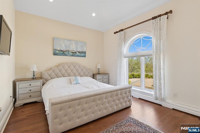 bedroom with recessed lighting, baseboards, and wood finished floors