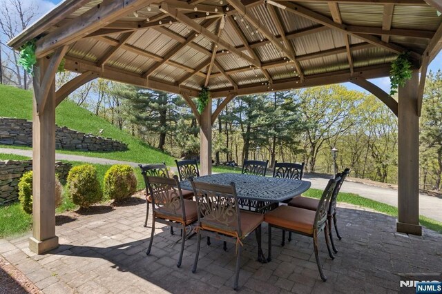 view of patio / terrace with a gazebo and outdoor dining area