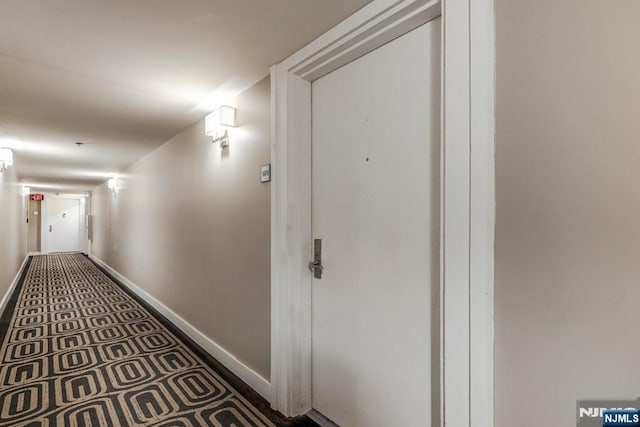 hallway featuring baseboards