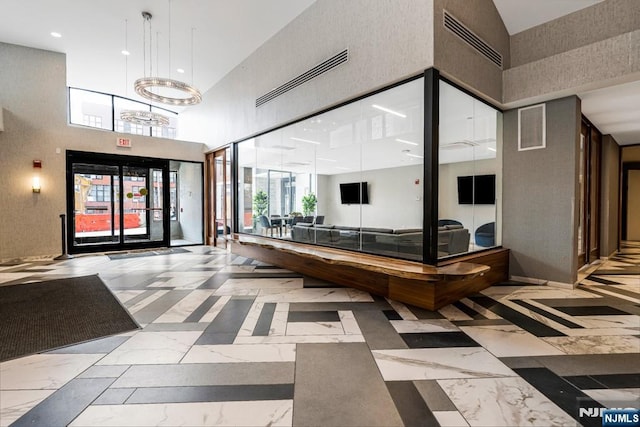 building lobby featuring visible vents