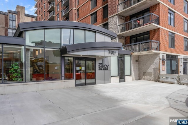 exterior space with brick siding