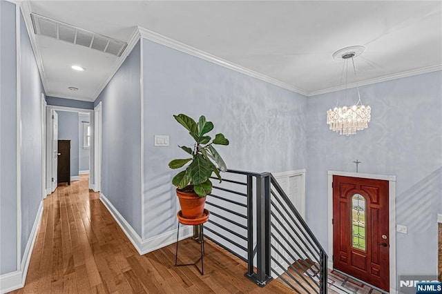 55 N Hillside Ave, Roxbury Township, NJ 07847 - foyer entrance with crown molding, visible vents, a chandelier, baseboards, and hardwood / wood-style flooring