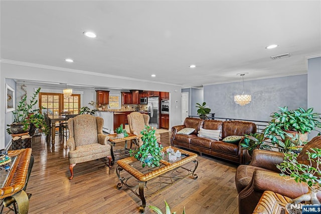 55 N Hillside Ave, Roxbury Township, NJ 07847 - living room featuring recessed lighting, an inviting chandelier, and crown molding