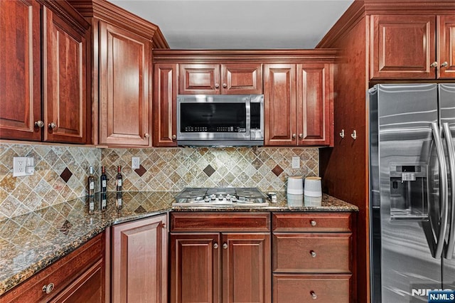 55 N Hillside Ave, Roxbury Township, NJ 07847 - kitchen featuring dark stone counters, appliances with stainless steel finishes, and decorative backsplash