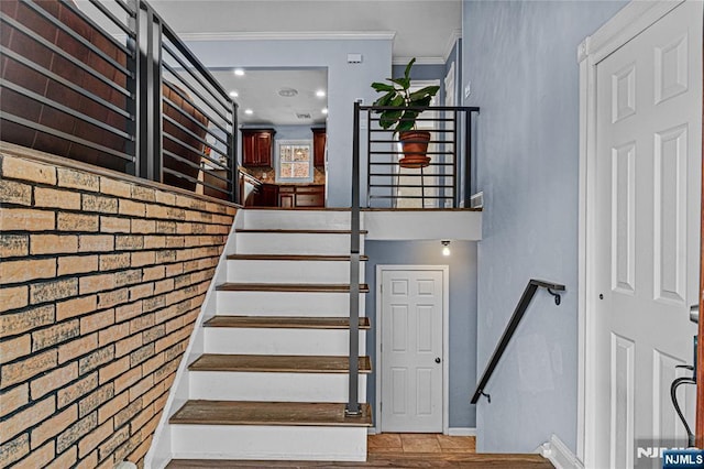 55 N Hillside Ave, Roxbury Township, NJ 07847 - stairway with crown molding, baseboards, and wood finished floors