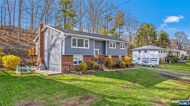 55 N Hillside Ave, Roxbury Township, NJ 07847 - bi-level home with a front yard, aphalt driveway, brick siding, and a chimney