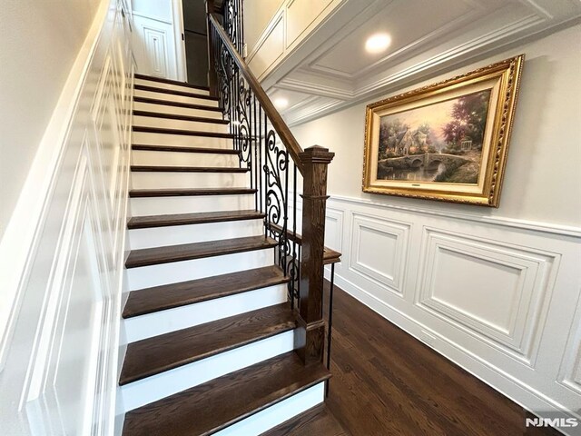 126 Closter Dock Rd, Closter, NJ 07624 - stairway with wood finished floors, crown molding, wainscoting, and a decorative wall