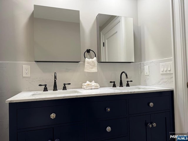 126 Closter Dock Rd, Closter, NJ 07624 - full bathroom featuring double vanity and tasteful backsplash