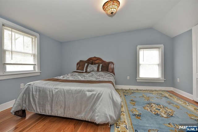 279 Boonton Ave, Butler Borough, NJ 07405 - bedroom with lofted ceiling, baseboards, and wood finished floors