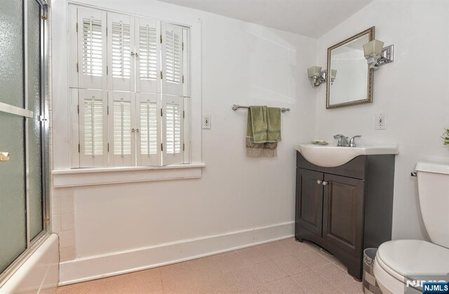 279 Boonton Ave, Butler Borough, NJ 07405 - bathroom featuring tile patterned floors, toilet, baseboards, vanity, and enclosed tub / shower combo