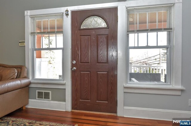 279 Boonton Ave, Butler Borough, NJ 07405 - foyer with baseboards, wood finished floors, and visible vents