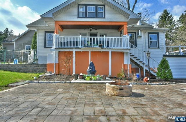 279 Boonton Ave, Butler Borough, NJ 07405 - view of front of house with stairway, a fire pit, fence, and a patio
