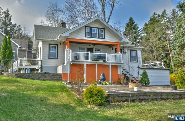 279 Boonton Ave, Butler Borough, NJ 07405 - view of front of house featuring a porch, a chimney, a shingled roof, stairway, and a front yard