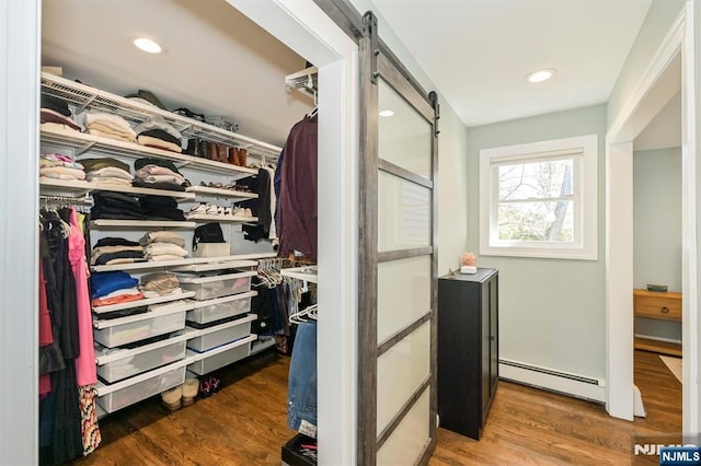 closet featuring baseboard heating