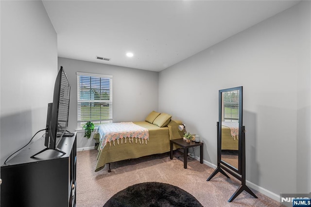 bedroom with visible vents, baseboards, and carpet floors