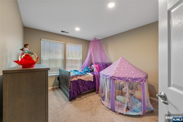 carpeted bedroom with recessed lighting, visible vents, and baseboards