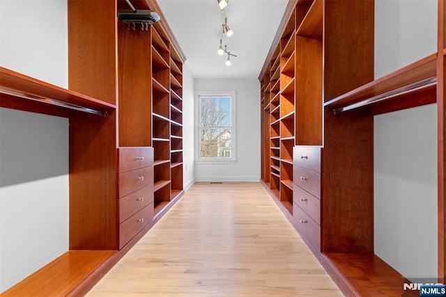 walk in closet featuring light wood-type flooring