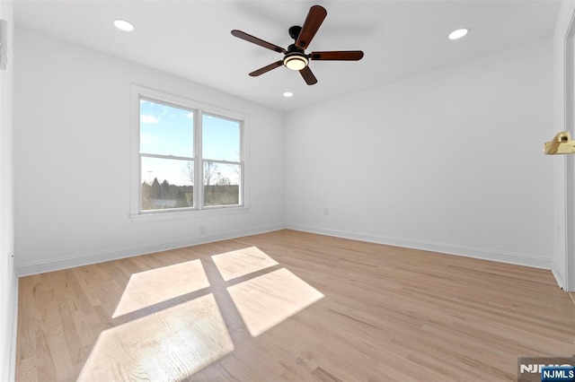 unfurnished room with baseboards, light wood-style flooring, ceiling fan, and recessed lighting