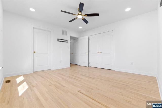 unfurnished bedroom with light wood finished floors, baseboards, visible vents, and recessed lighting