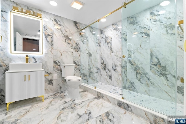 bathroom featuring marble finish floor, toilet, vanity, and a marble finish shower