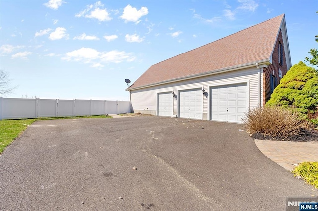 detached garage with fence